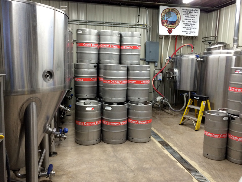 A stack of kegs in a brewery.